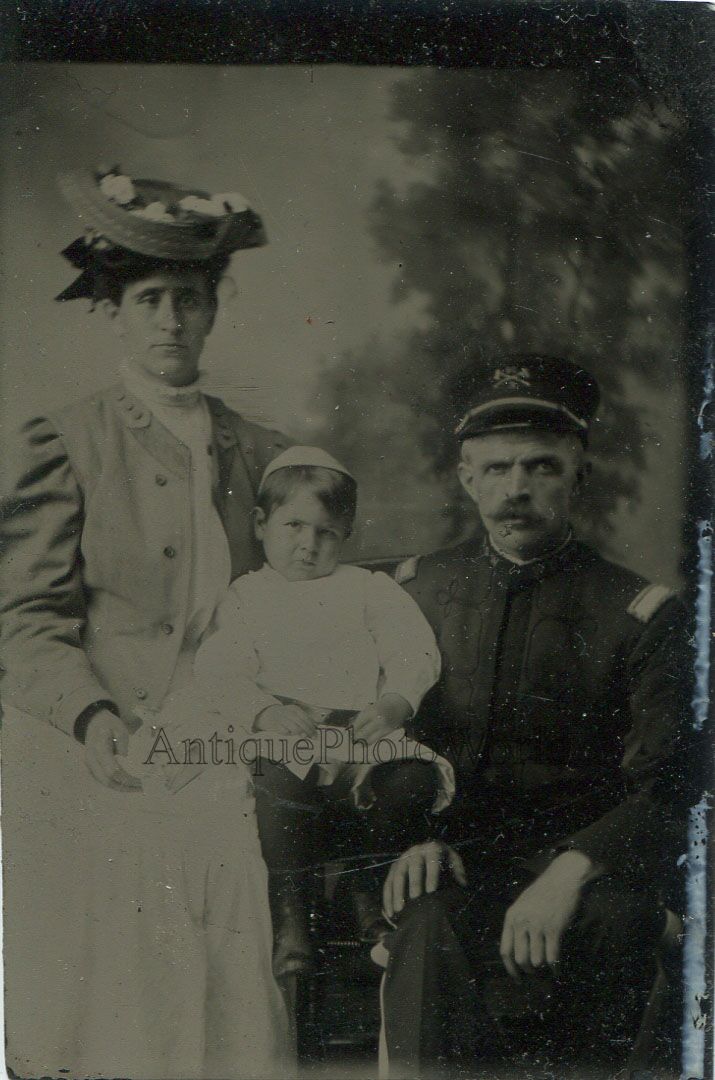 Fireman firefighter in uniform with family antique tintype photo